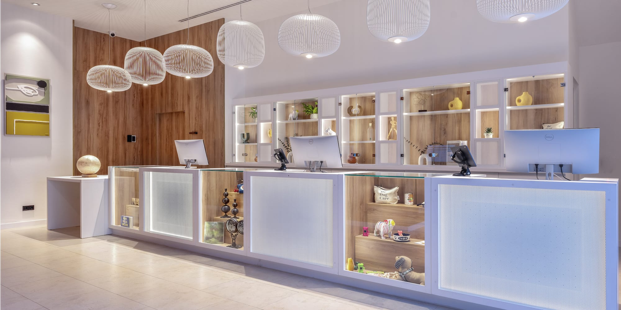 a reception desk with shelves and lights