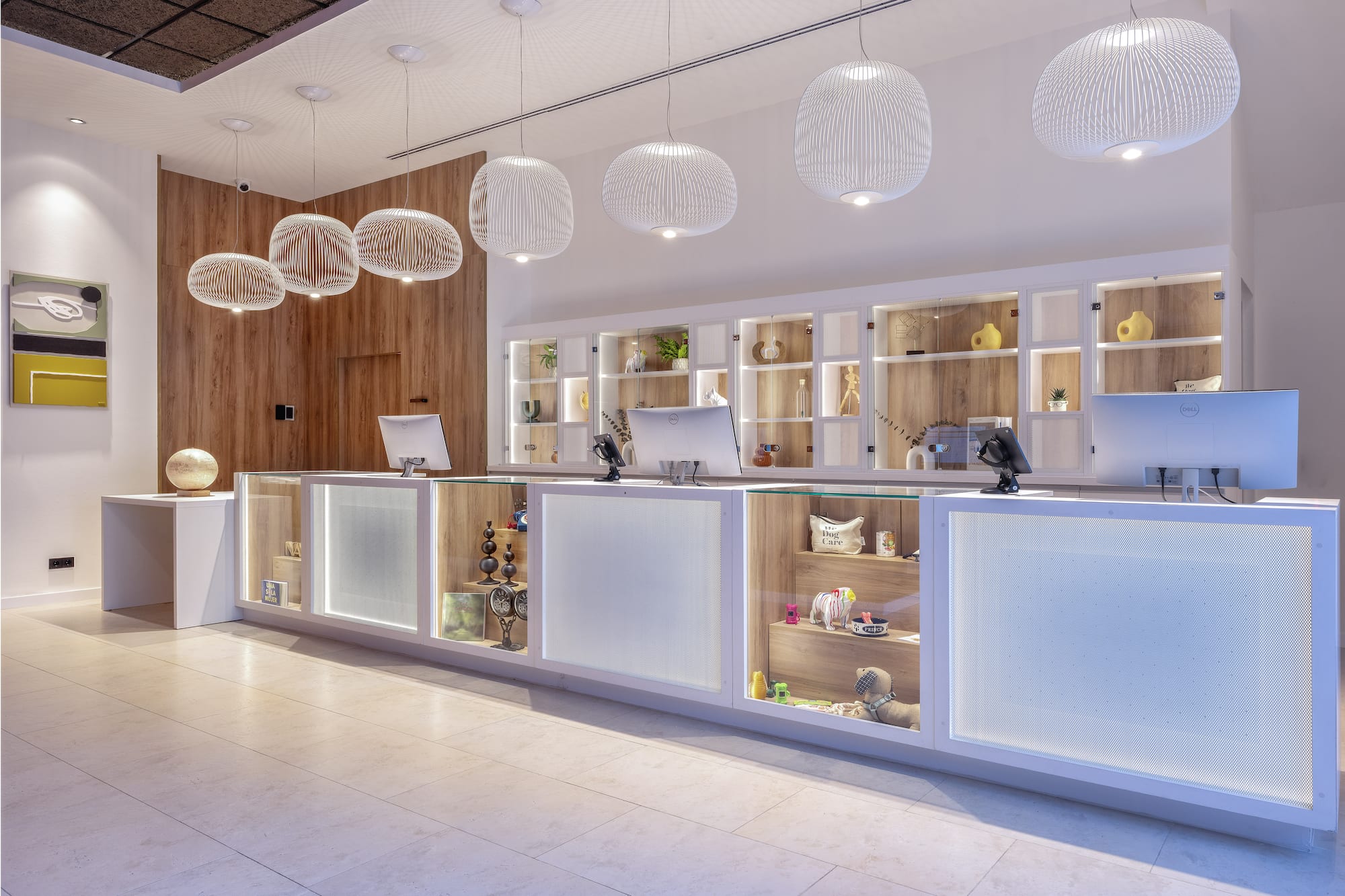 a reception desk with shelves and lights