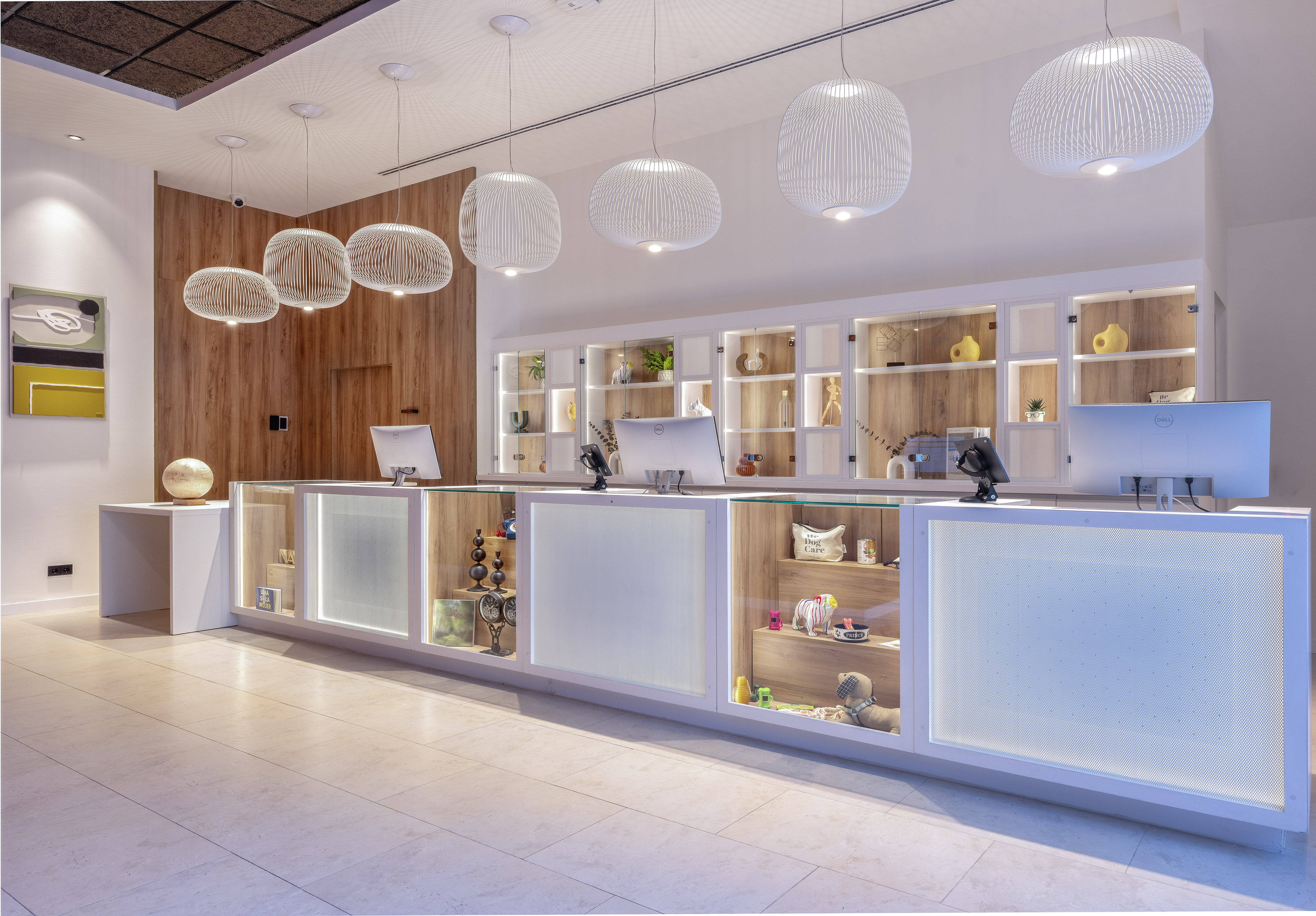 a reception desk with shelves and lights