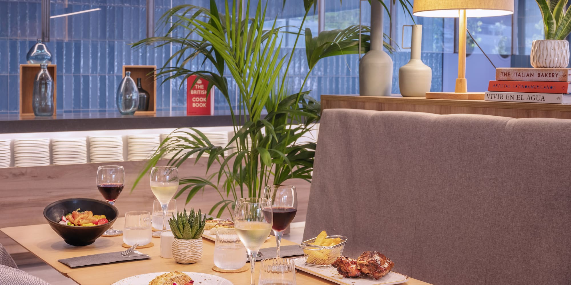 a table with food and wine glasses on it