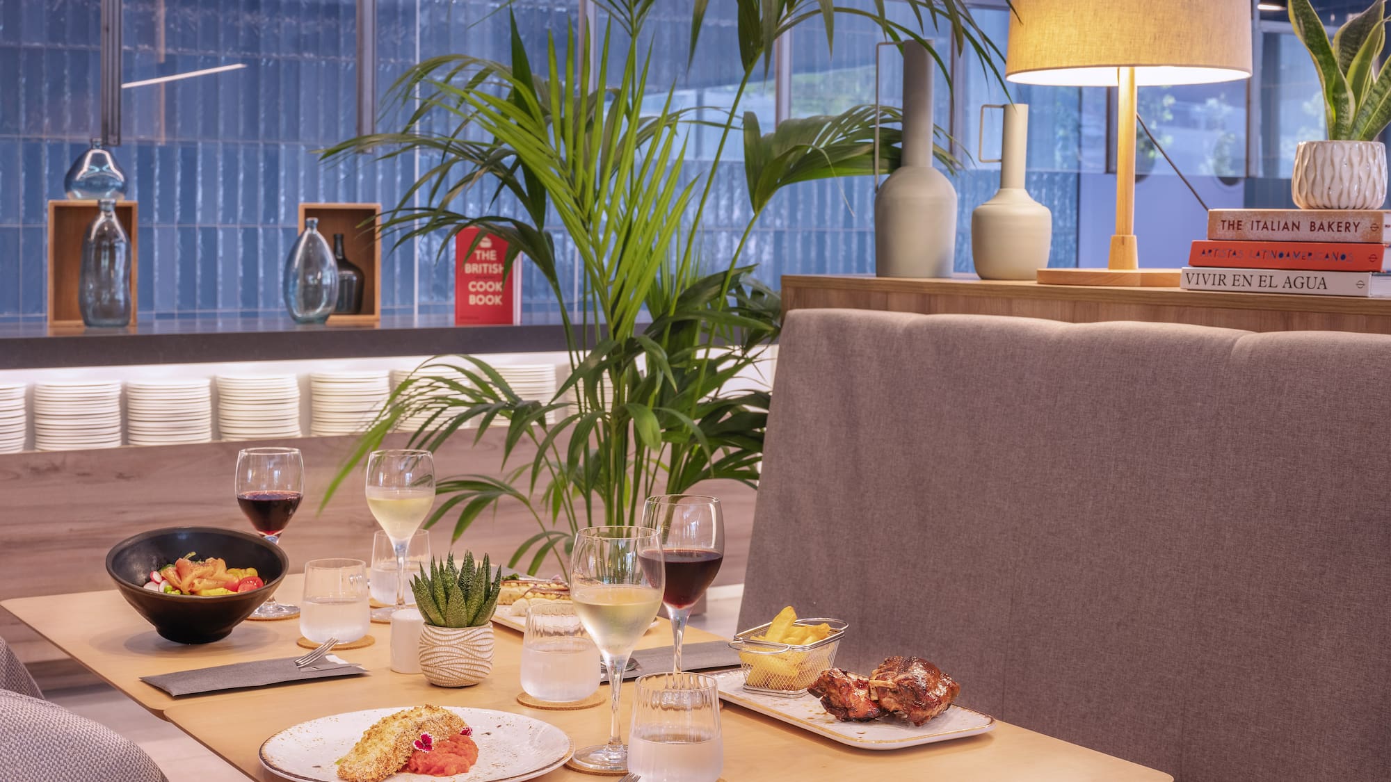 a table with food and wine glasses on it