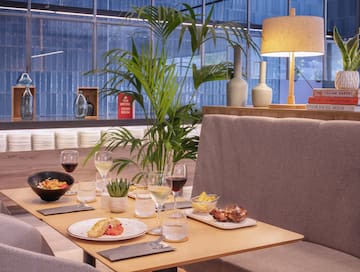 a table with food and wine glasses on it