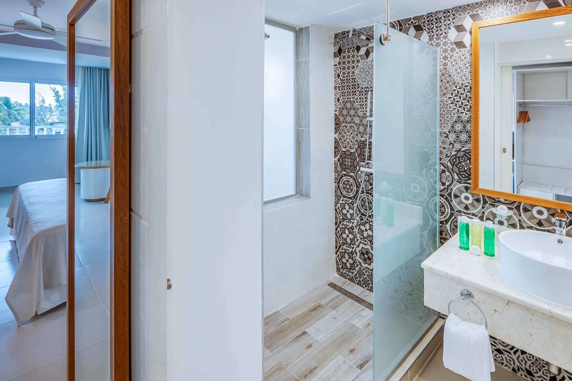 a bathroom with a shower and sink