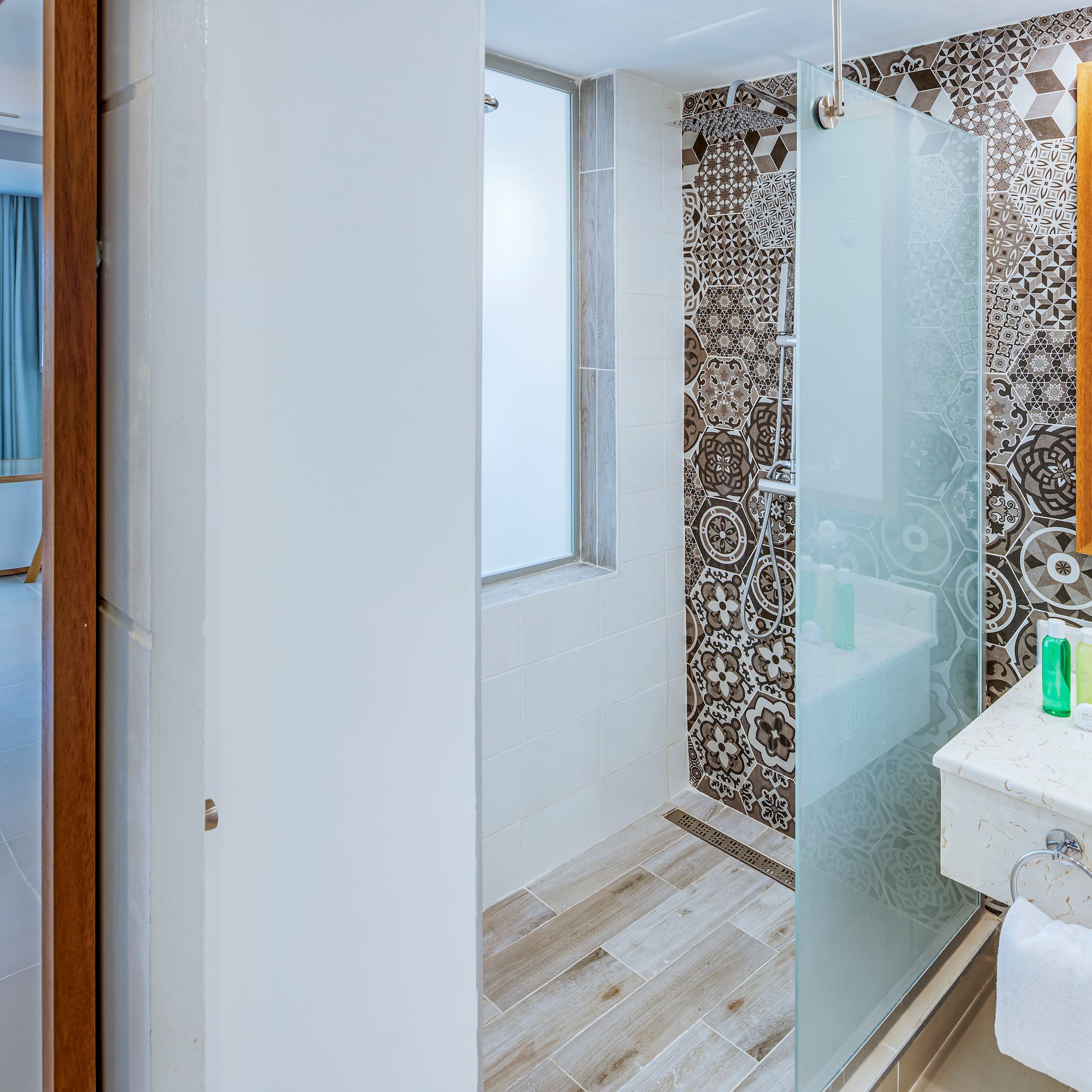 a bathroom with a shower and sink