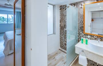 a bathroom with a shower and sink