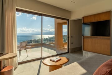 a living room with a glass sliding door and a table
