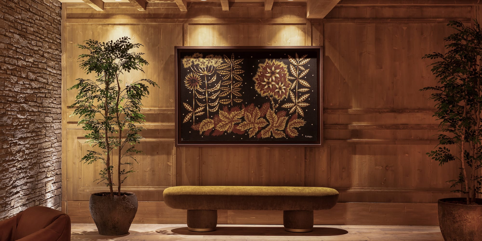 a room with a bench and a plant in a pot