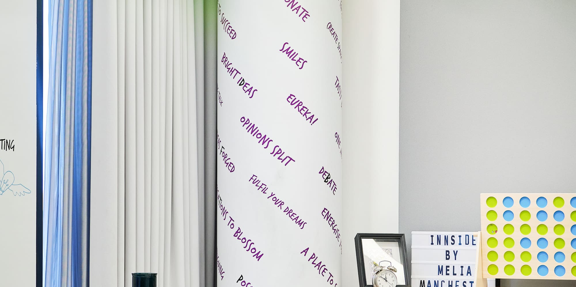 a room with a white board and shelves