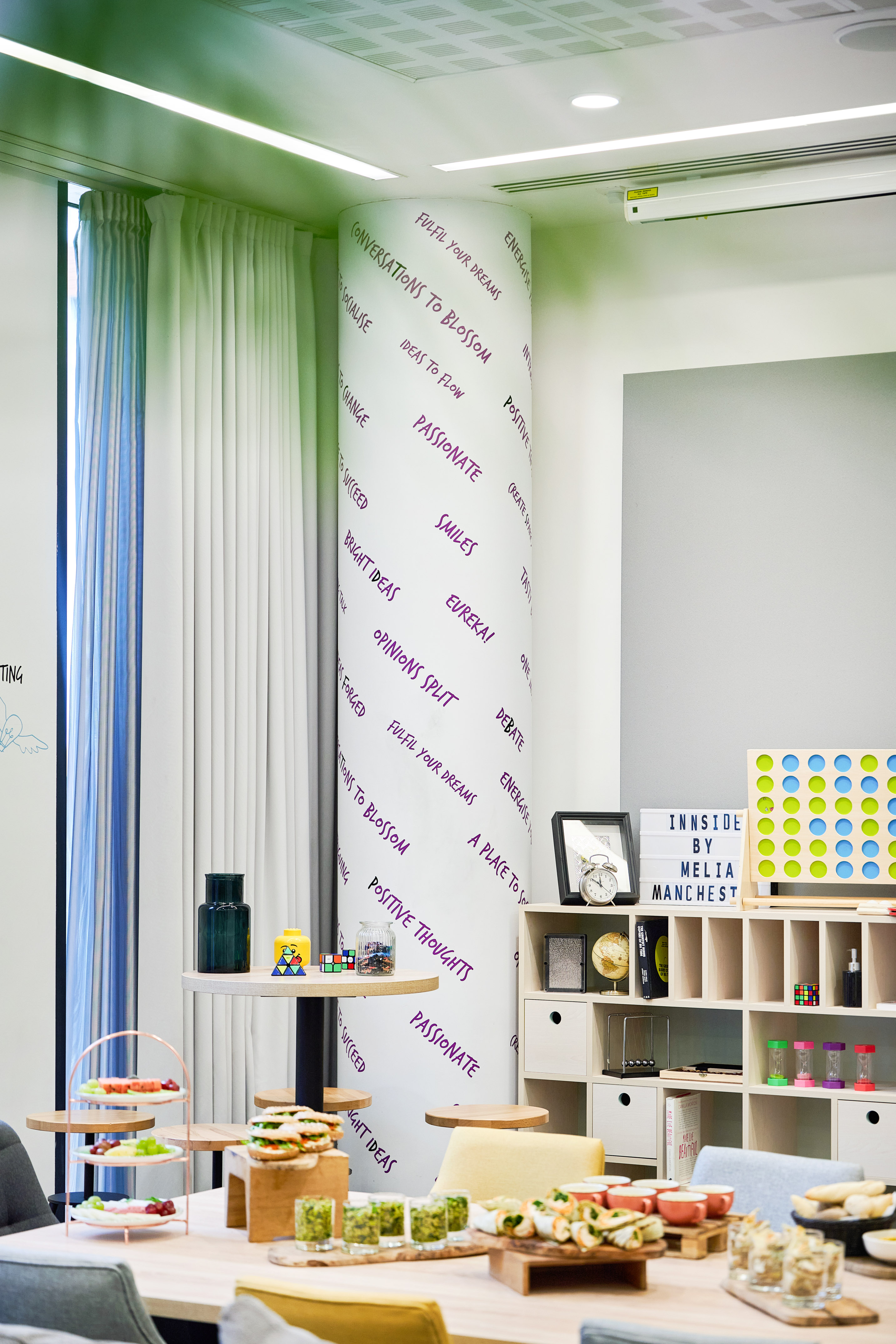a room with a white board and shelves