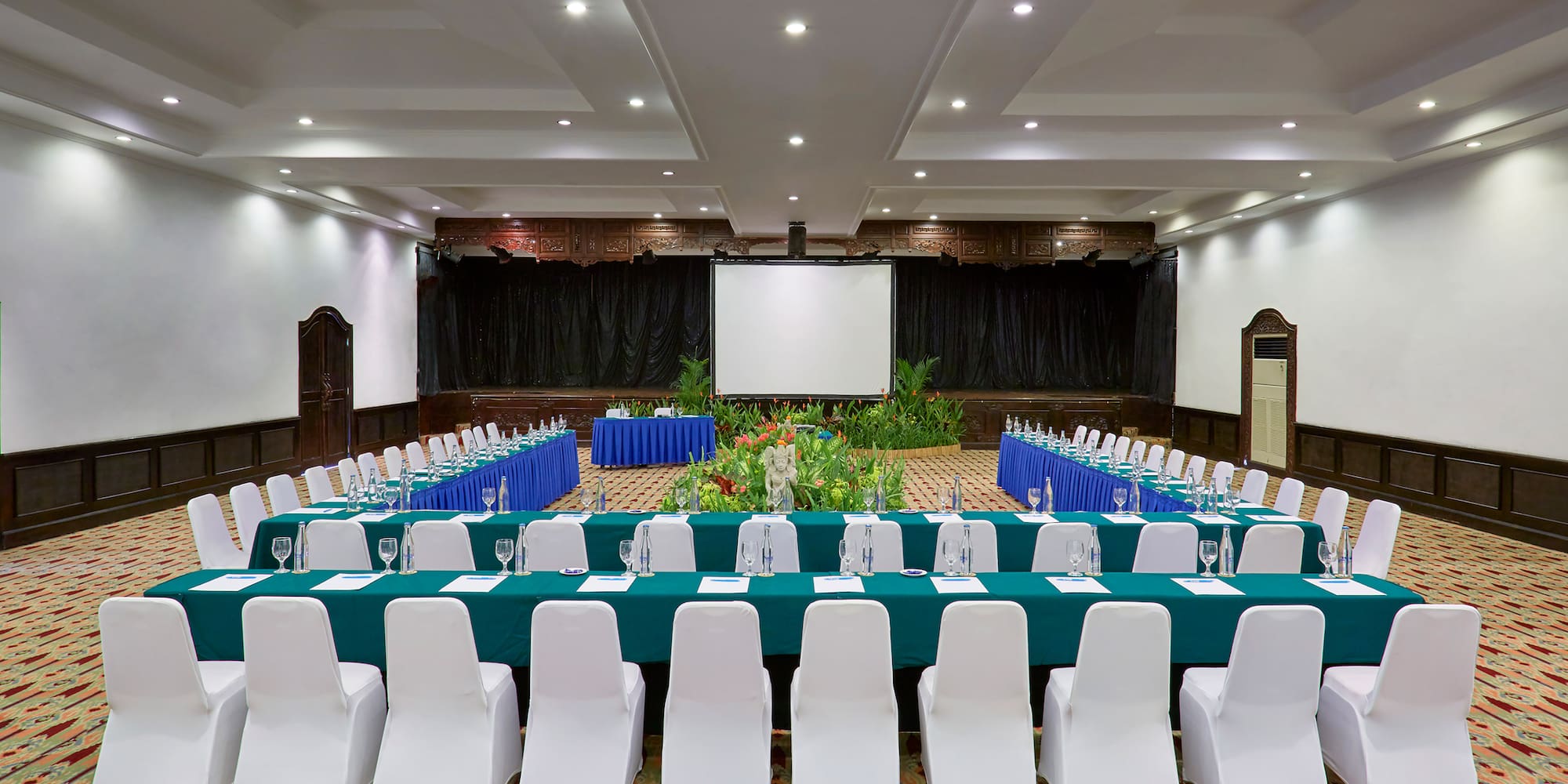 a room with a large table and chairs