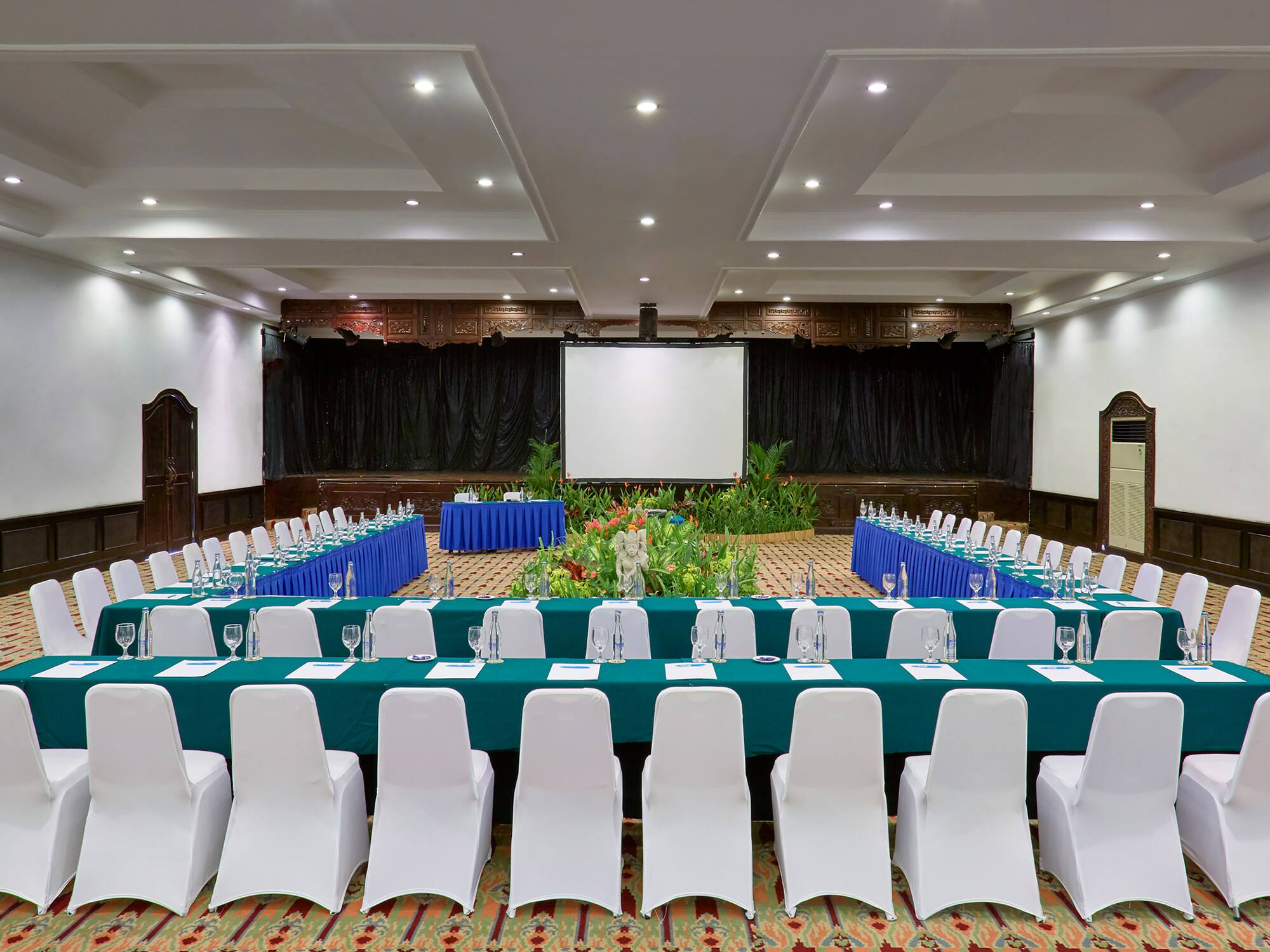a room with a large table and chairs