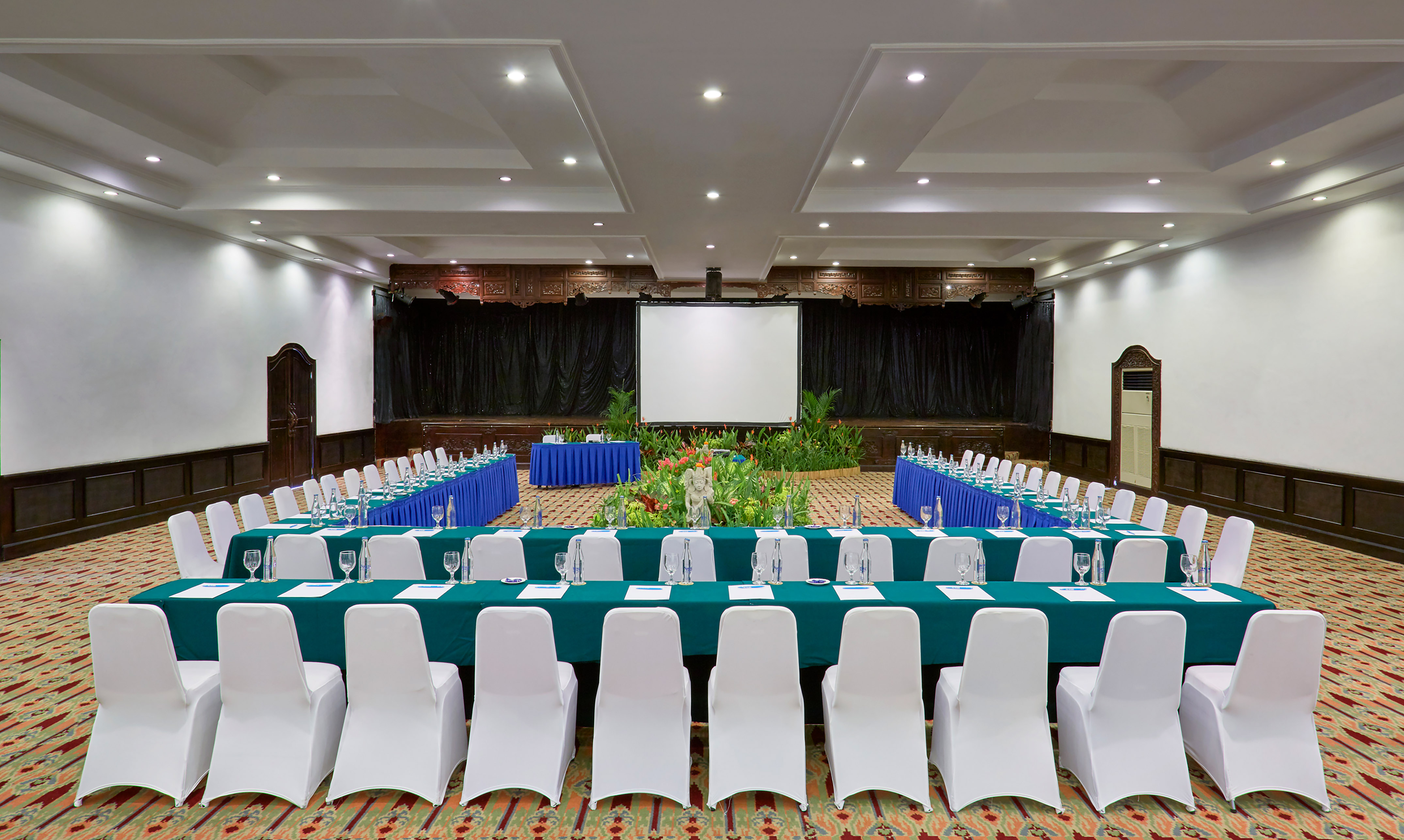 a room with a large table and chairs