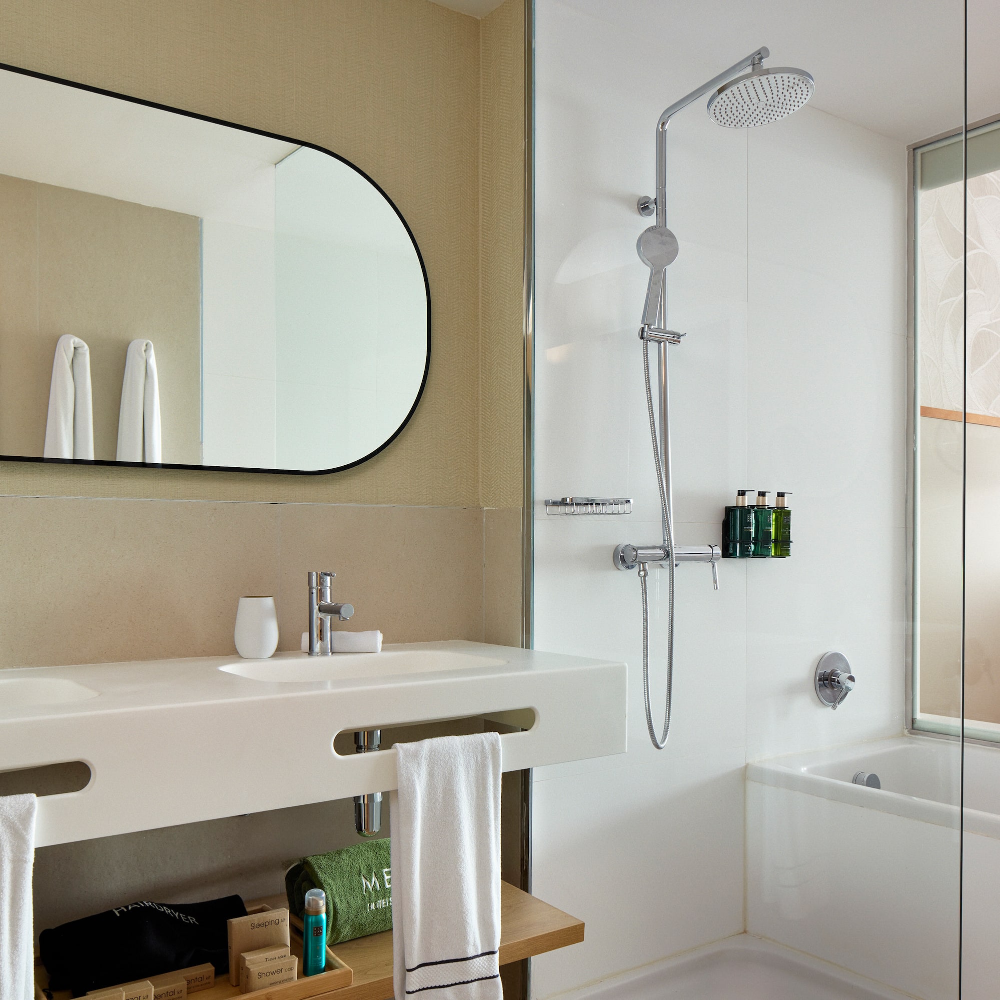 a bathroom with a shower and a sink