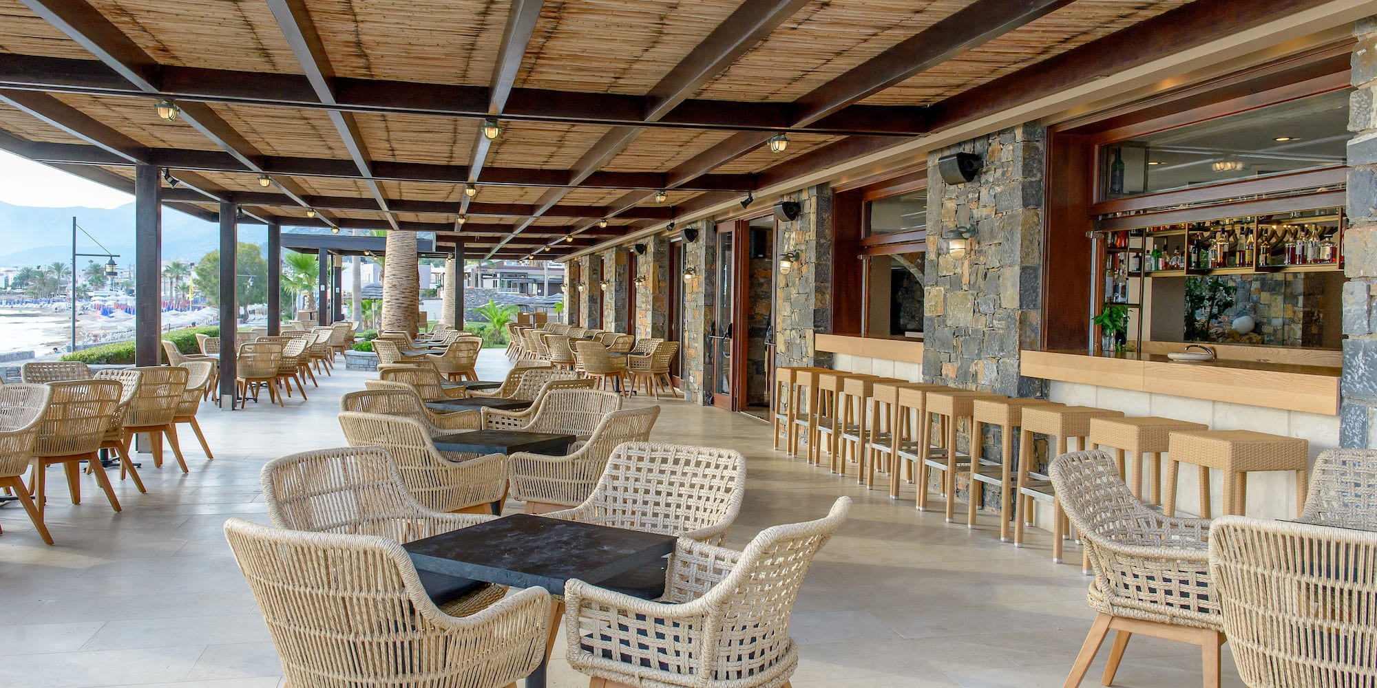 a patio with chairs and tables