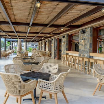 a patio with chairs and tables