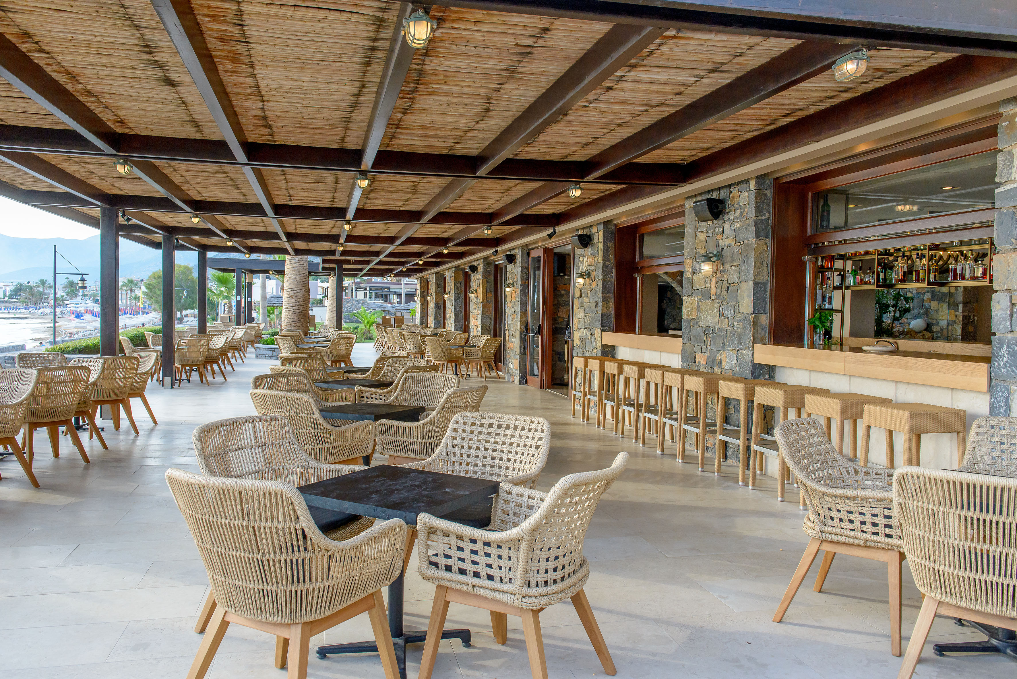 a patio with chairs and tables