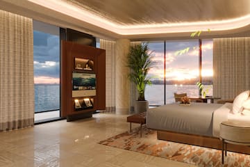 a room with a large window overlooking the water