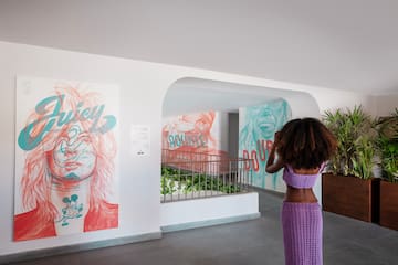 a woman taking a picture of a woman