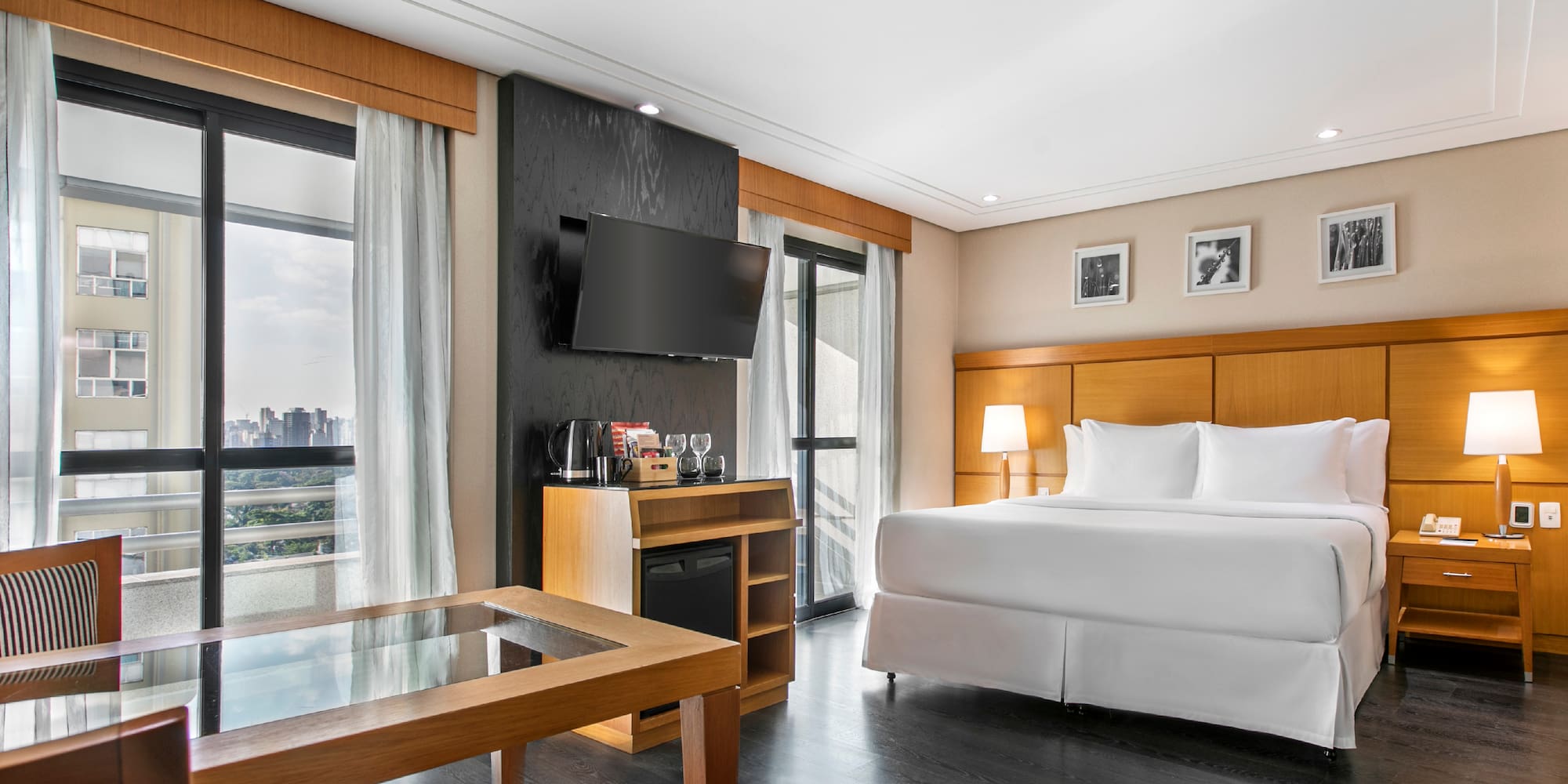 a room with a bed and a television