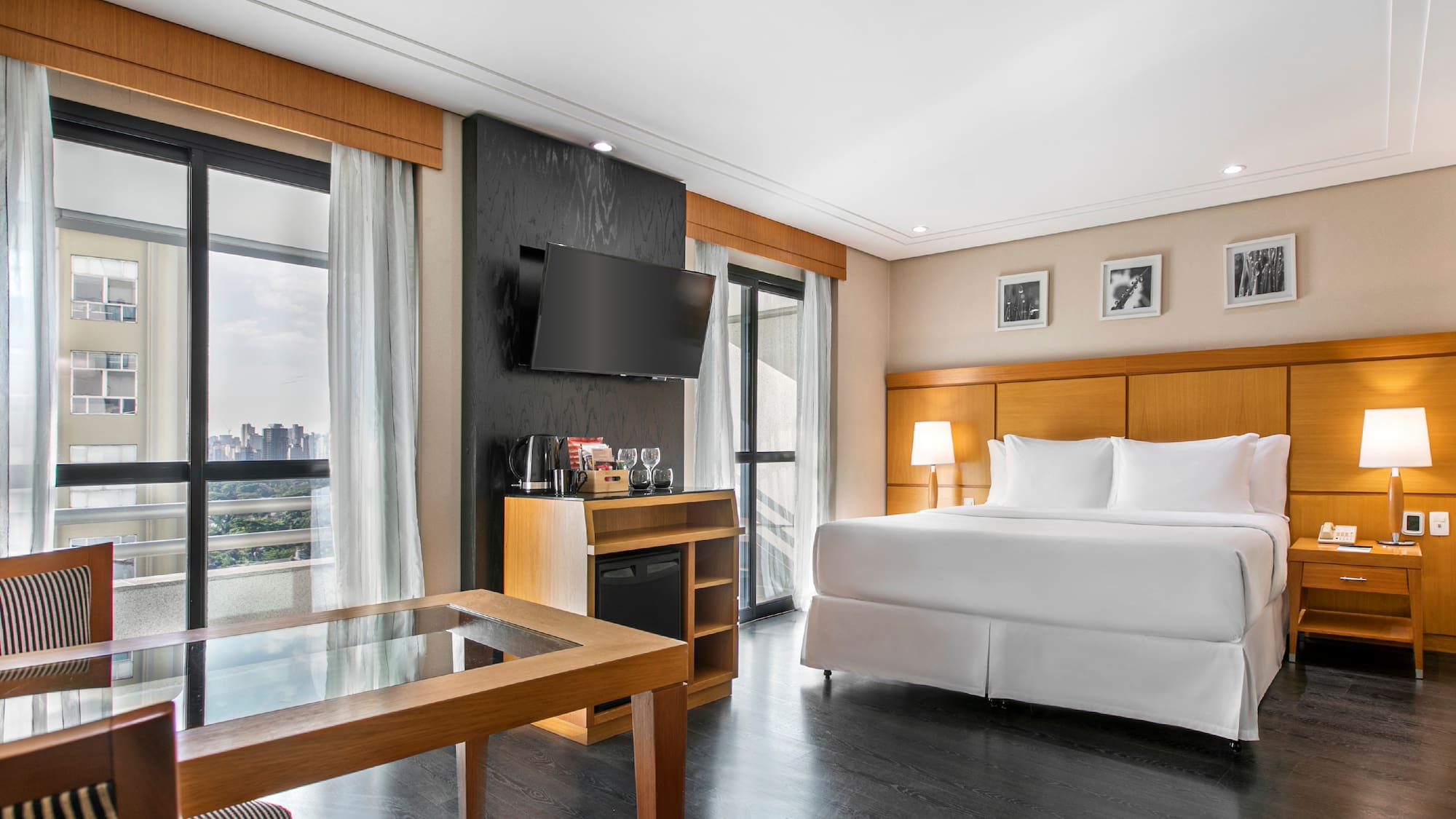 a room with a bed and a television