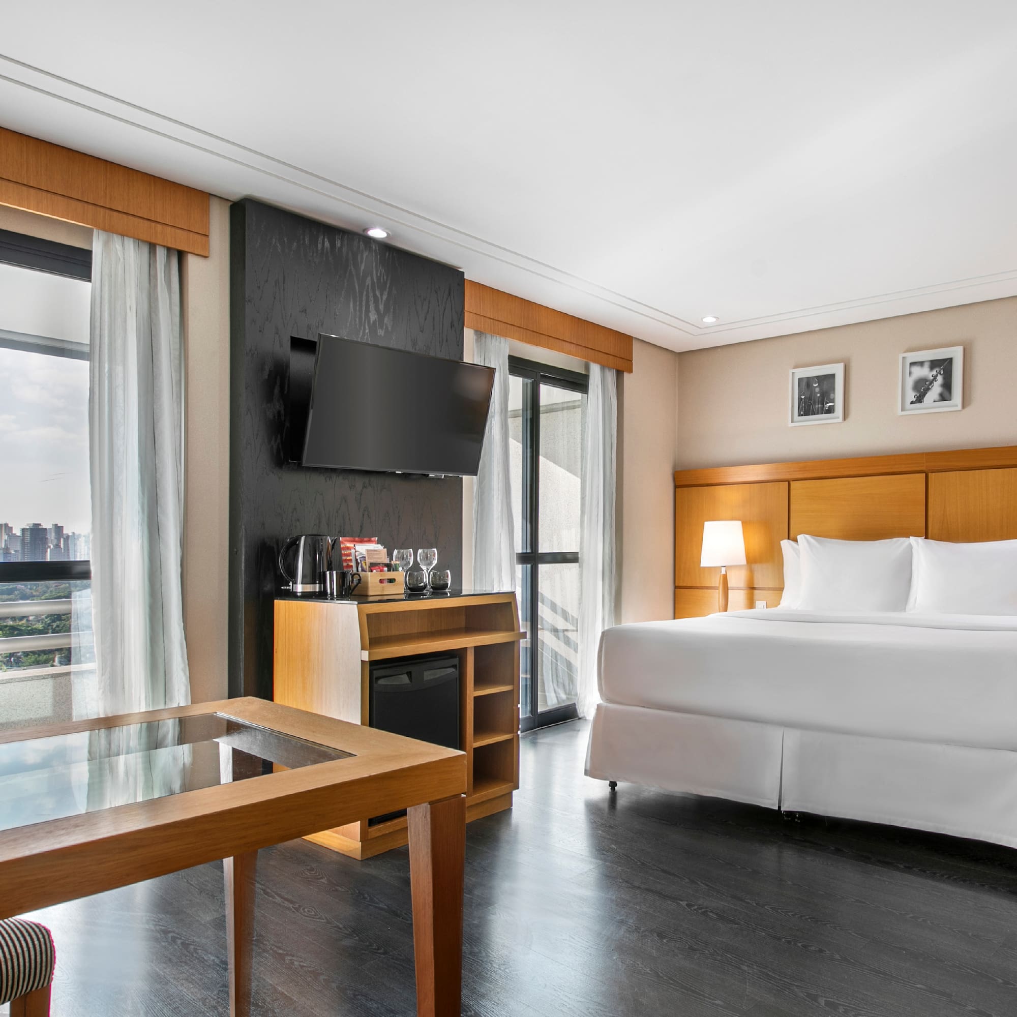 a room with a bed and a television