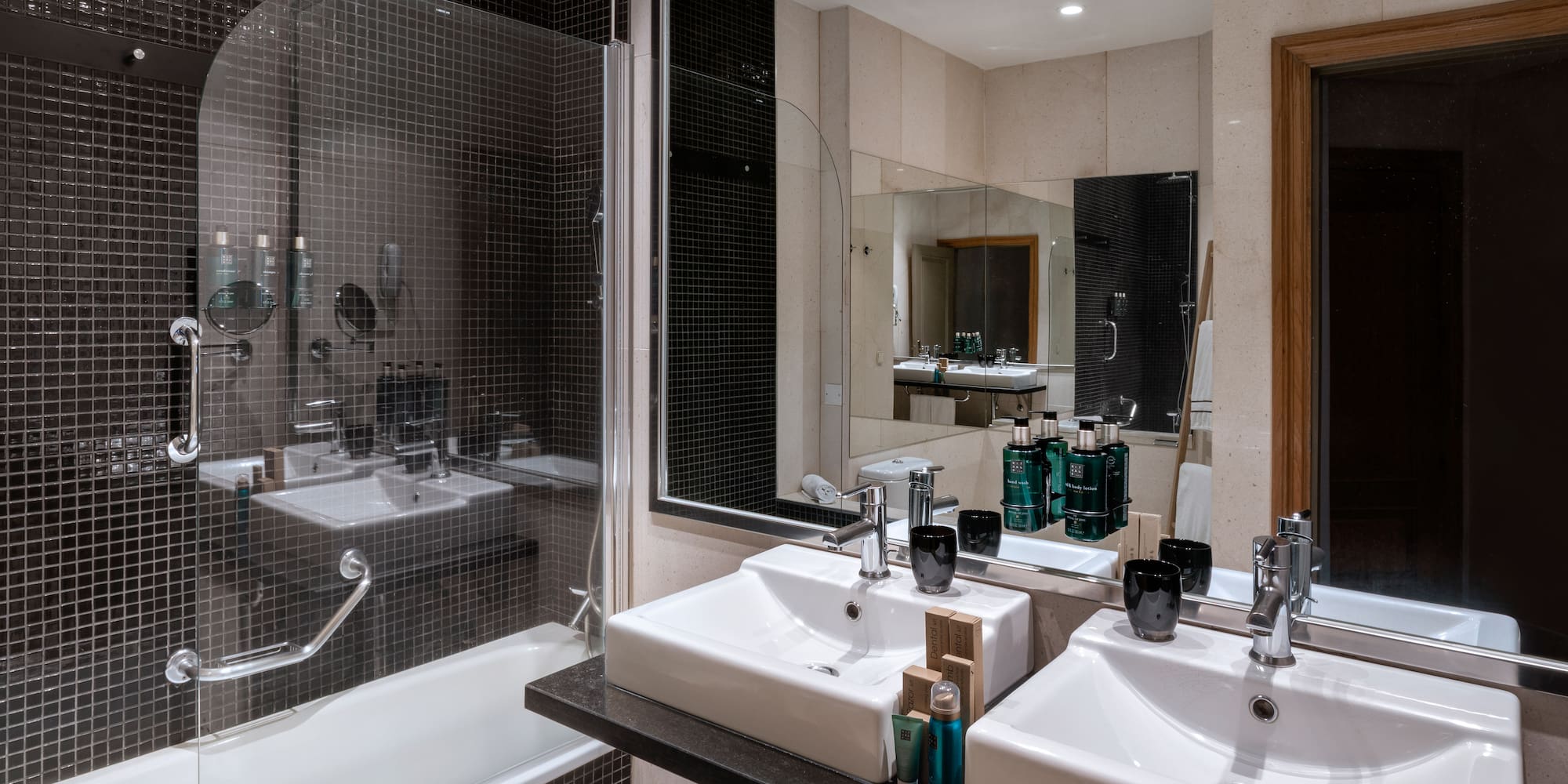 a bathroom with a shower and sink