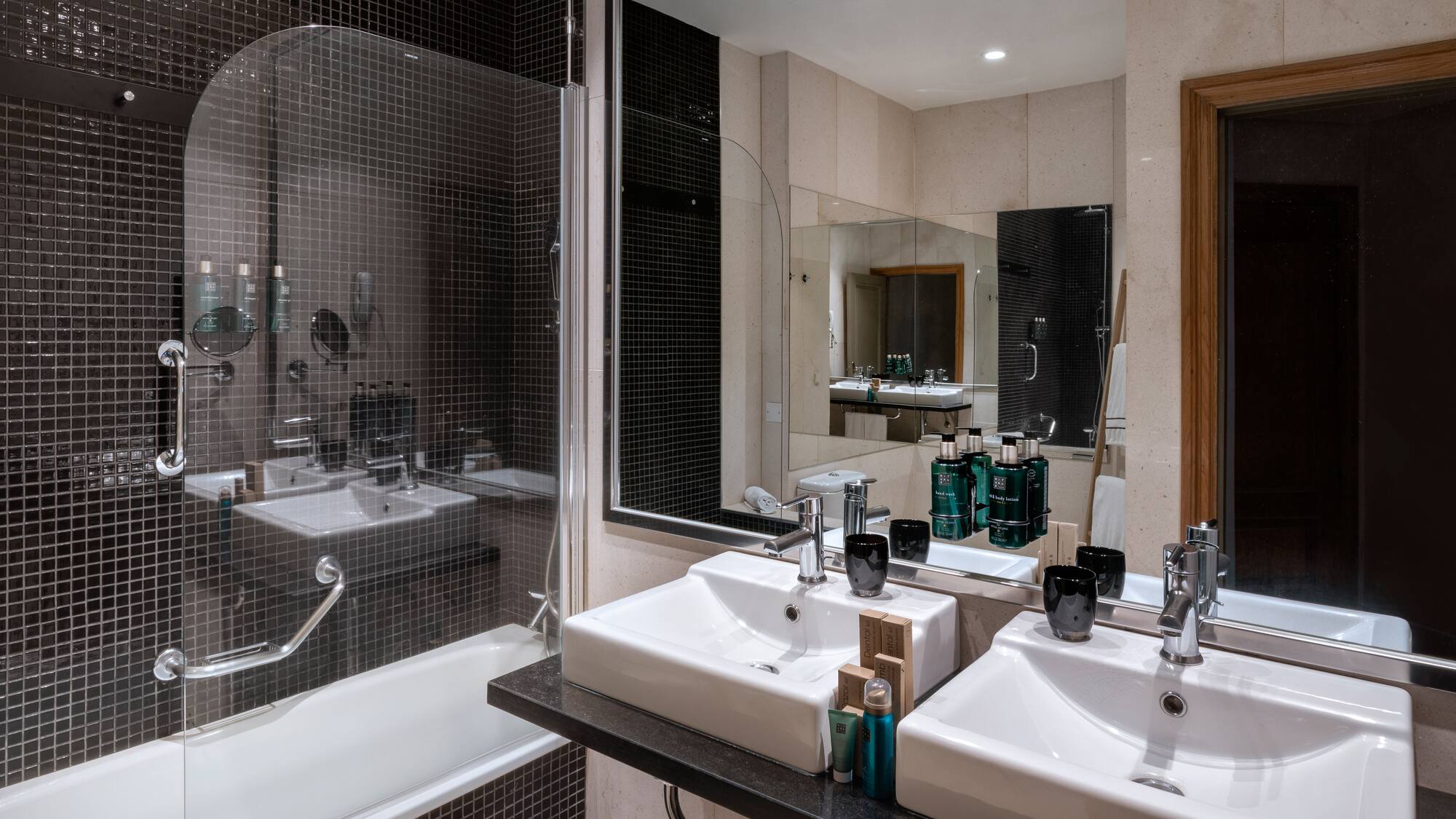 a bathroom with a shower and sink