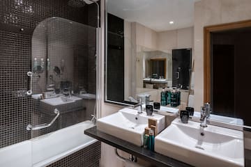 a bathroom with a shower and sink