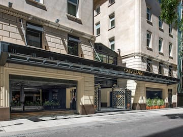 a building with windows and a grey background
