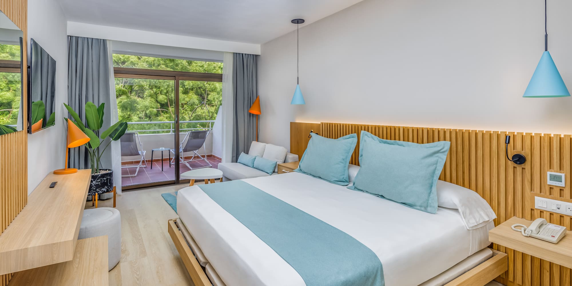 a bedroom with a bed and a plant