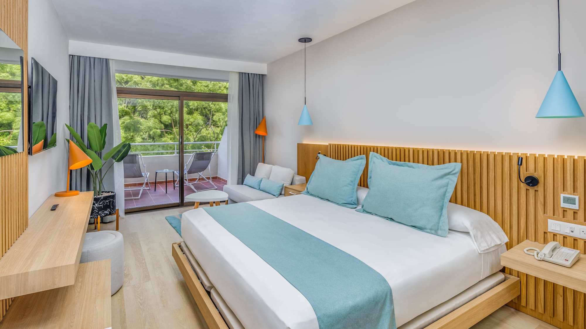 a bedroom with a bed and a plant