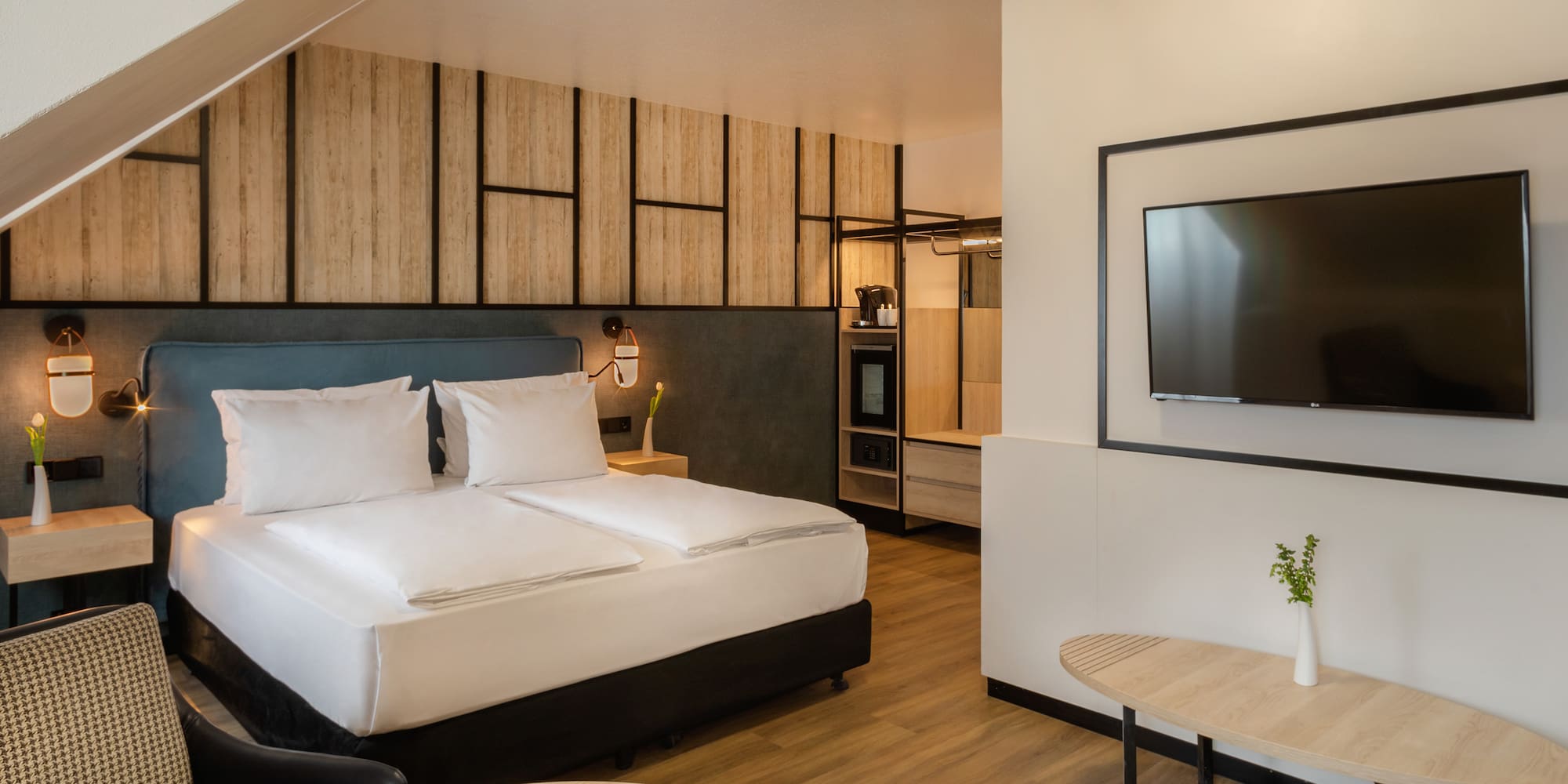 a room with a bed and a television