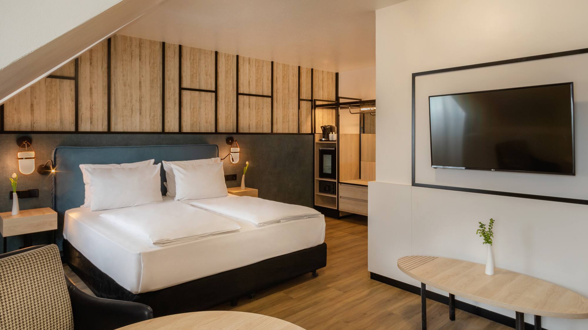 a room with a bed and a television