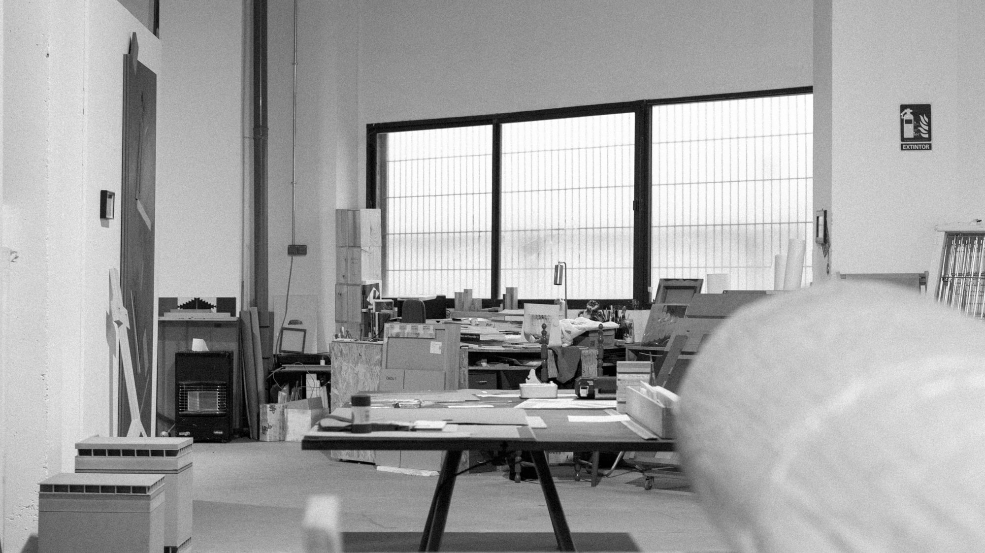 a room with a large table and a large window