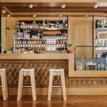 a bar with a counter and stools
