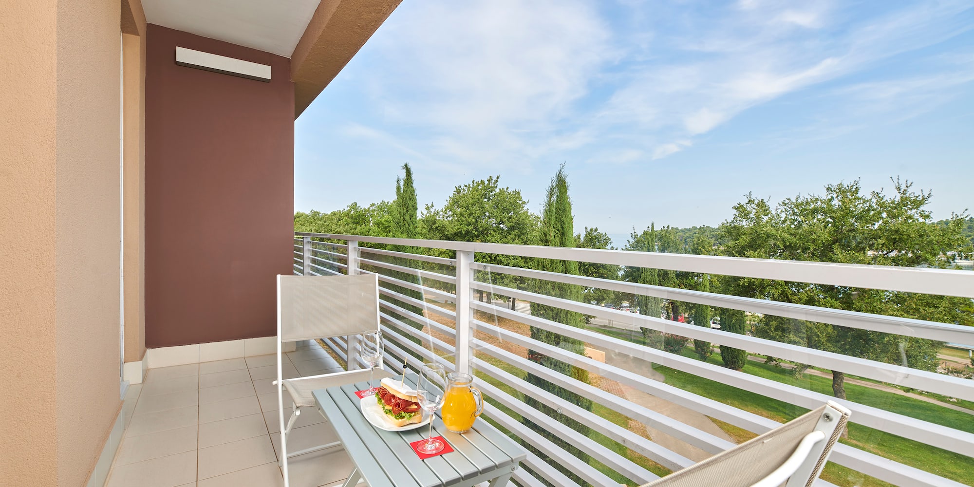 a table and chairs on a balcony