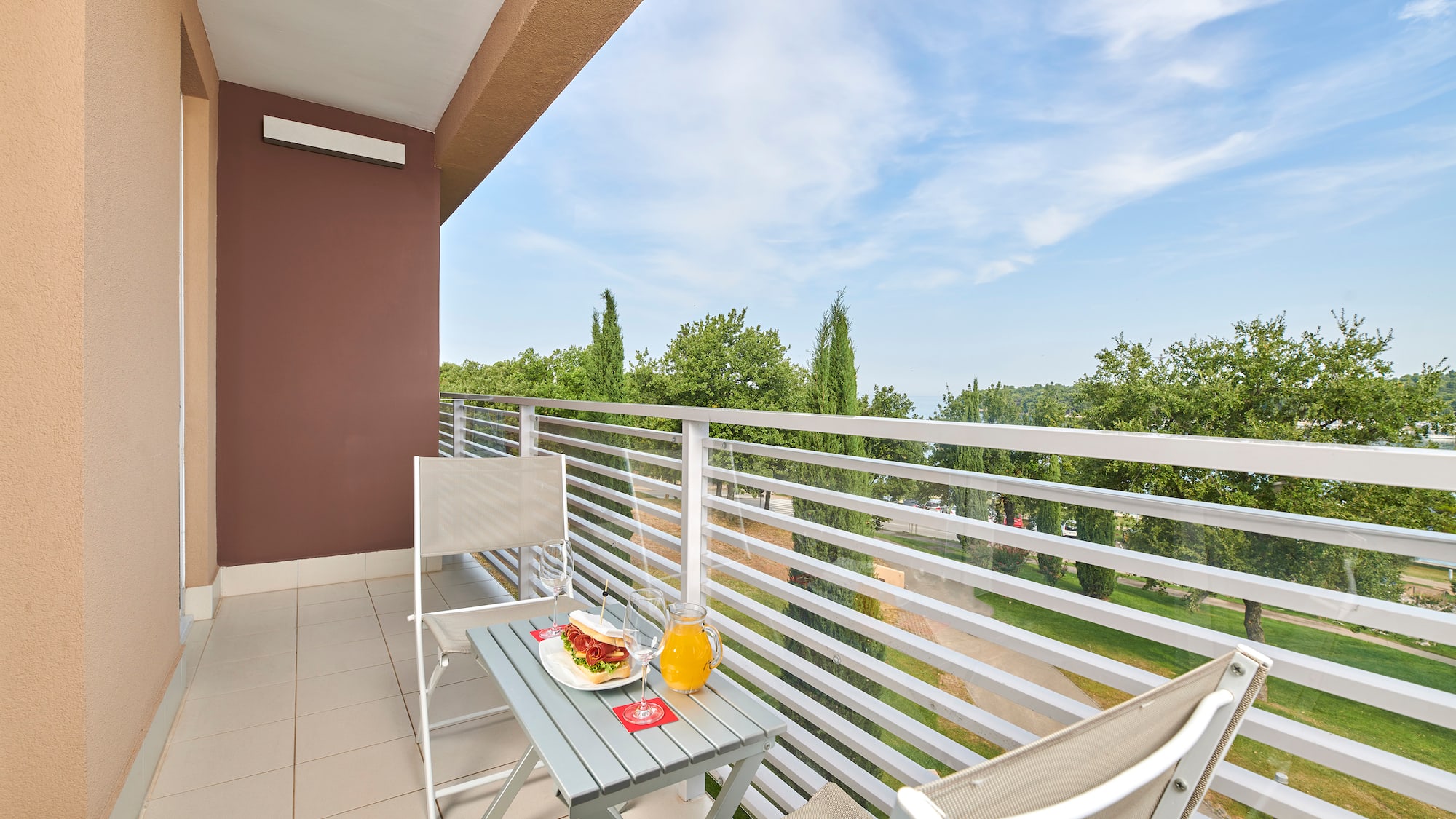 a table and chairs on a balcony