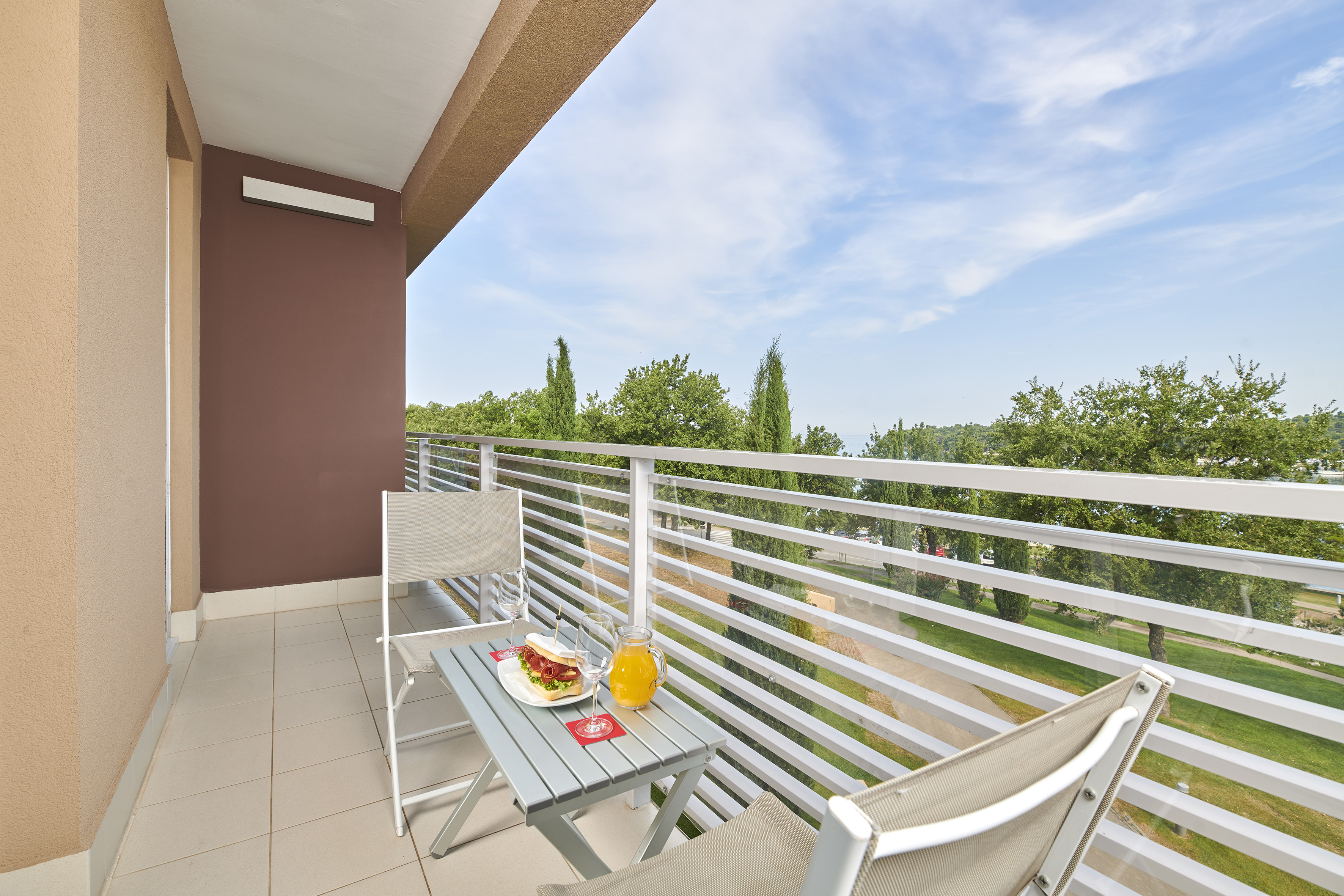 a table and chairs on a balcony