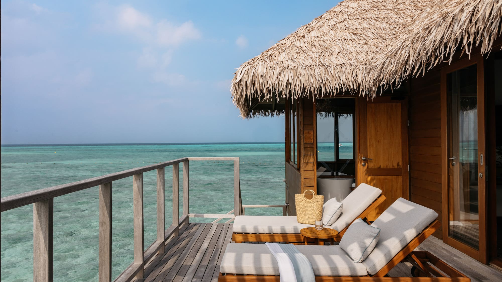 a room with a bed and couches