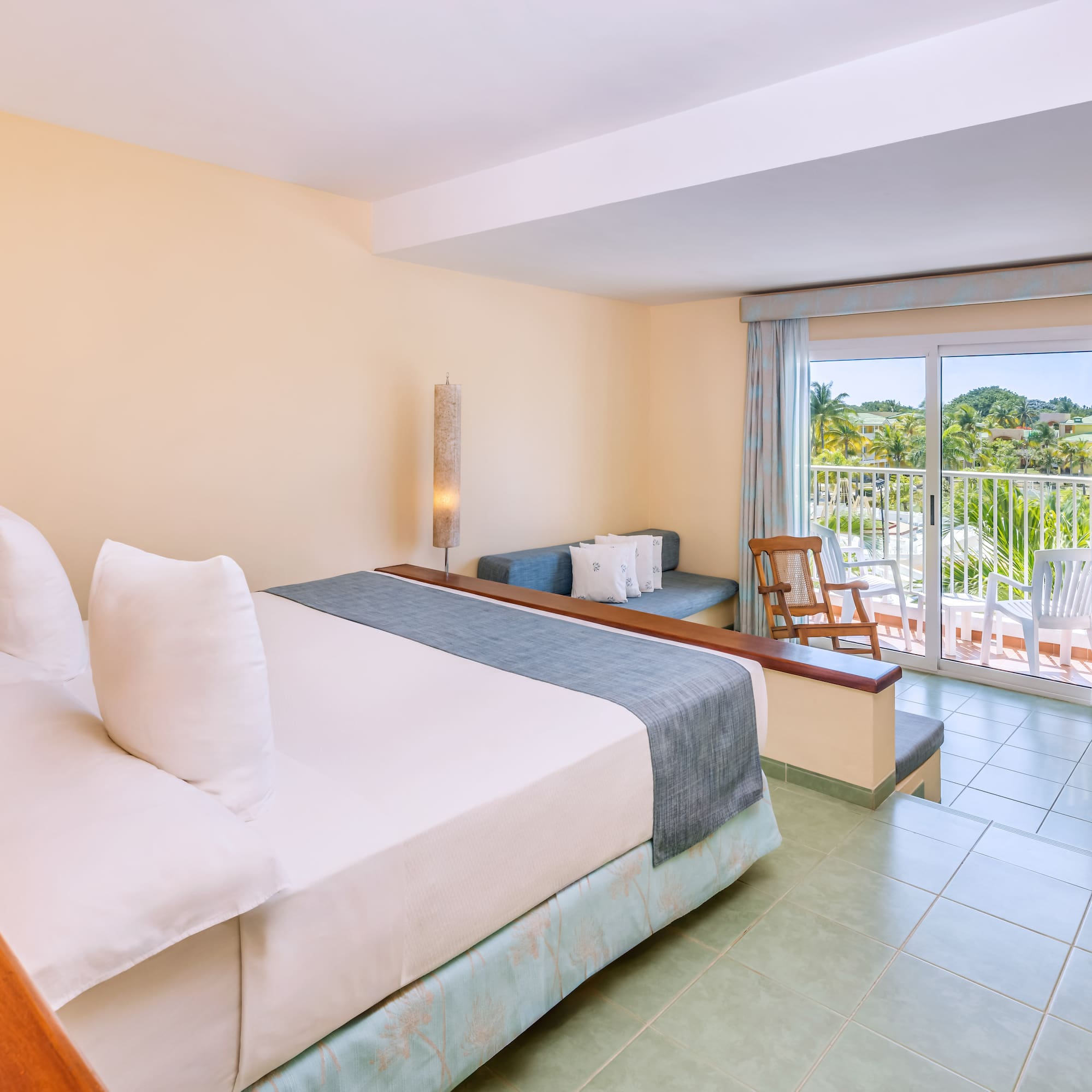 a room with a bed and a balcony