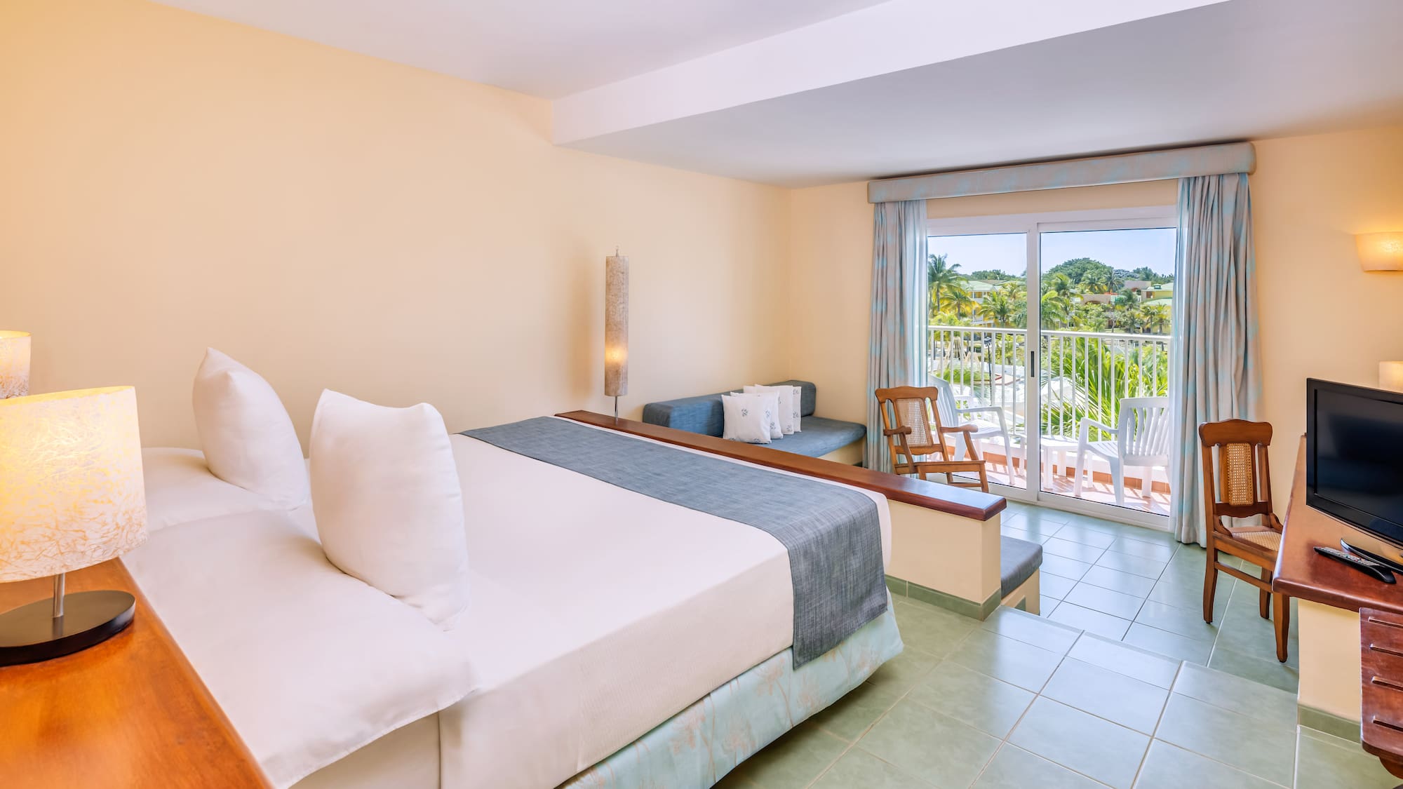 a room with a bed and a balcony