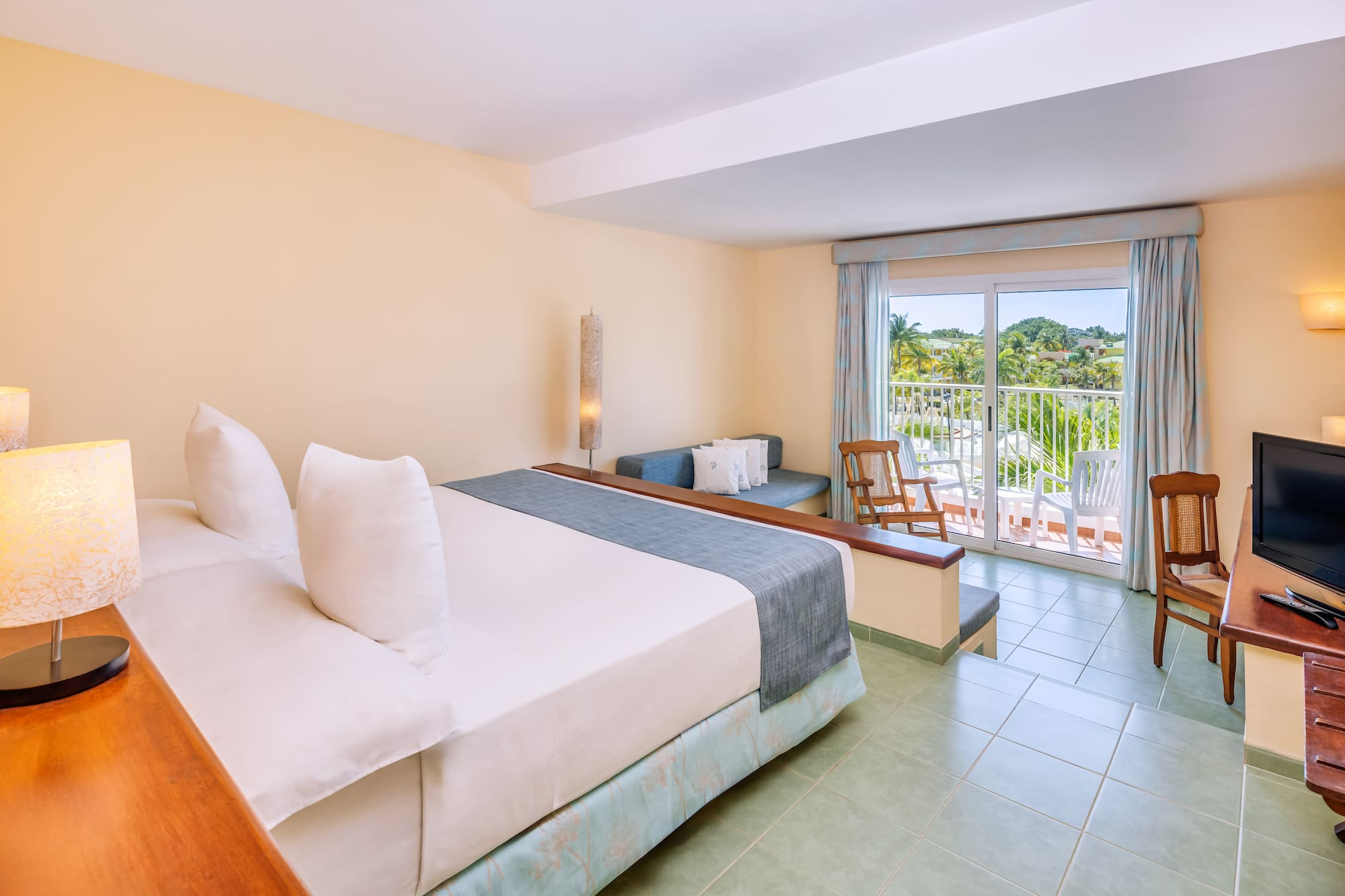 a room with a bed and a balcony