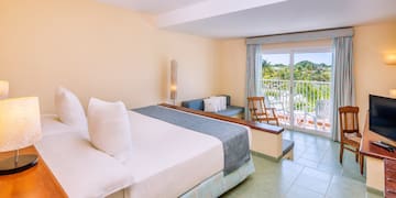 a room with a bed and a balcony