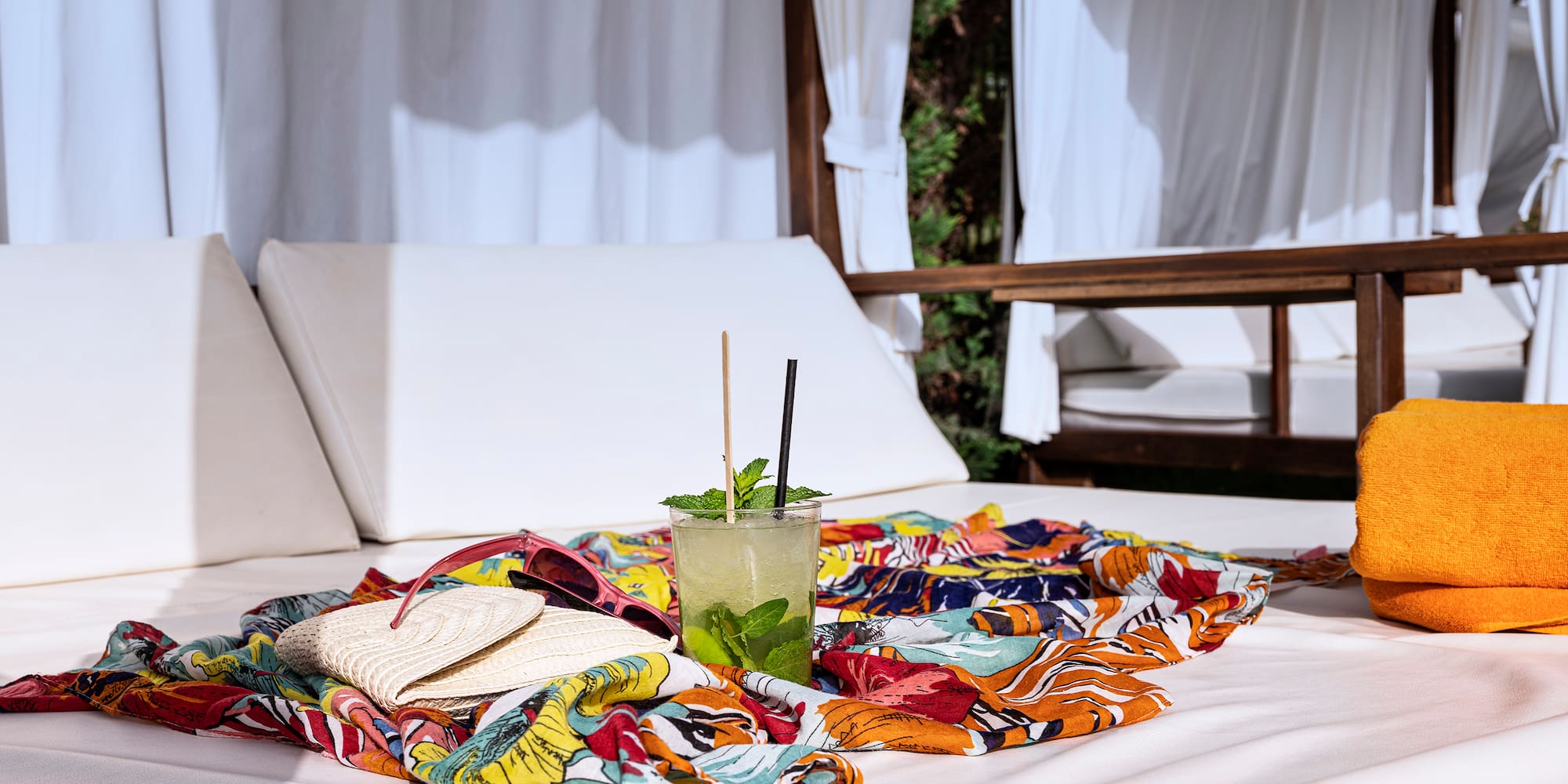 a table with a drink and a towel on it