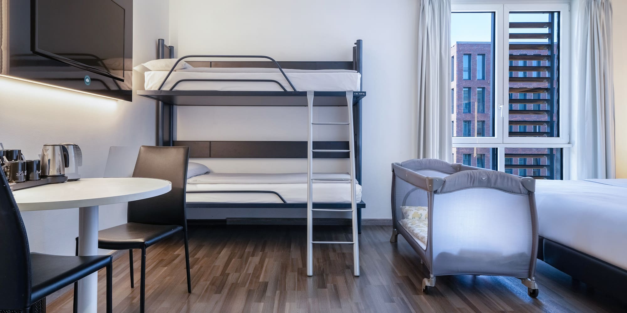 a room with a bunk bed and a table