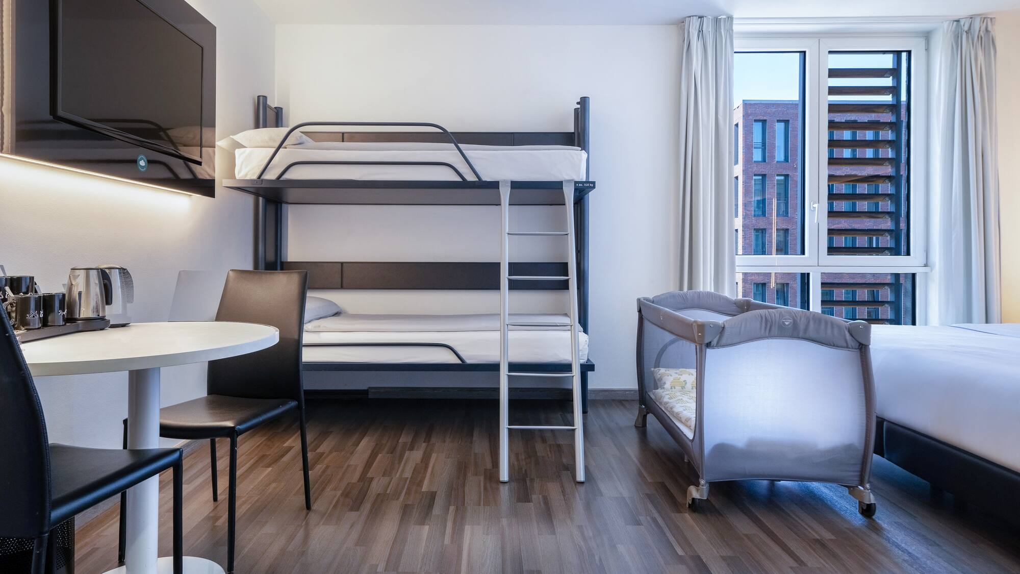 a room with a bunk bed and a table