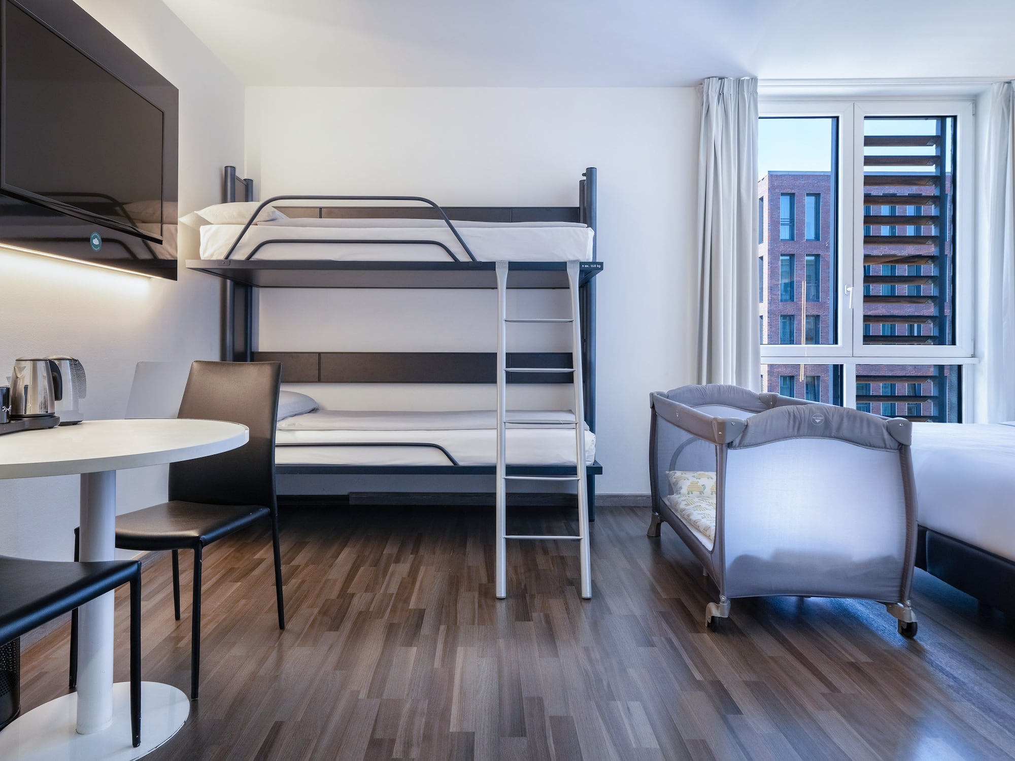 a room with a bunk bed and a table