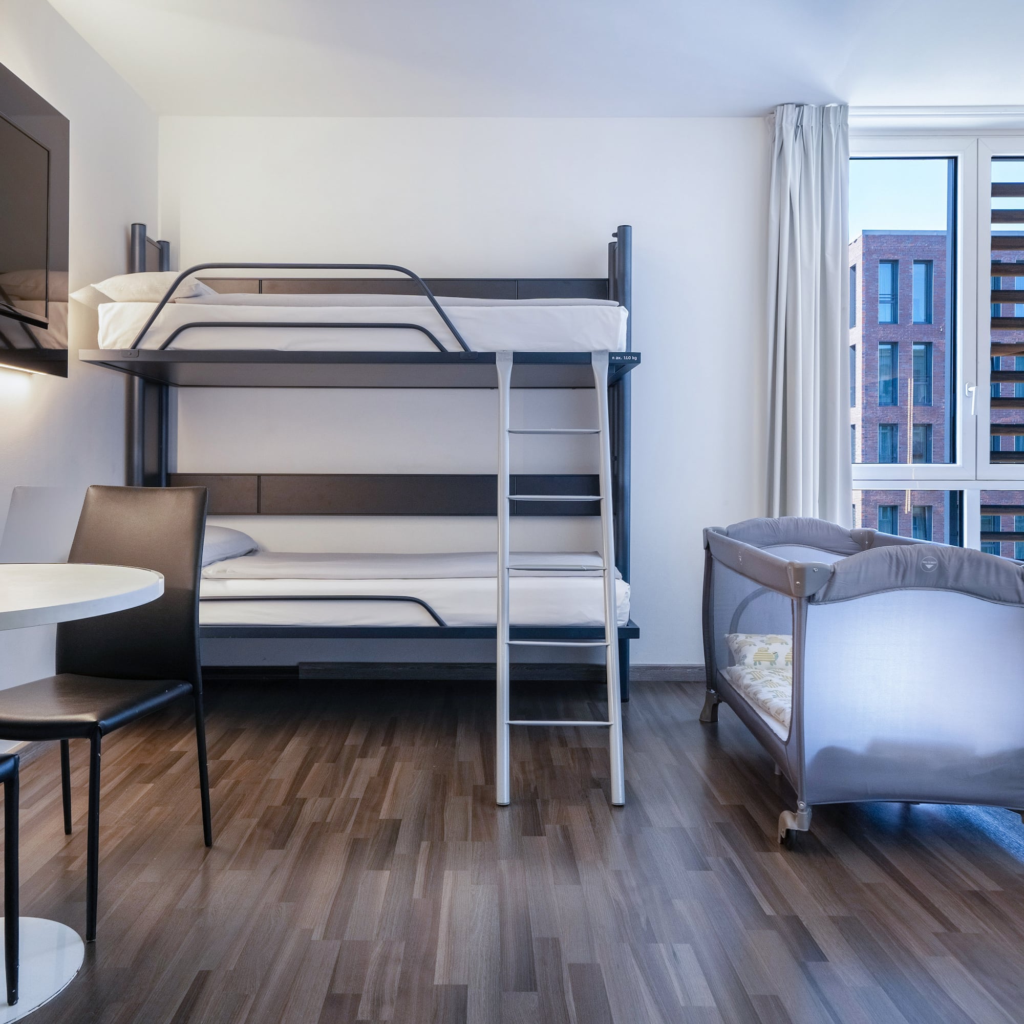 a room with a bunk bed and a table