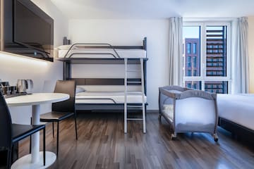 a room with a bunk bed and a table