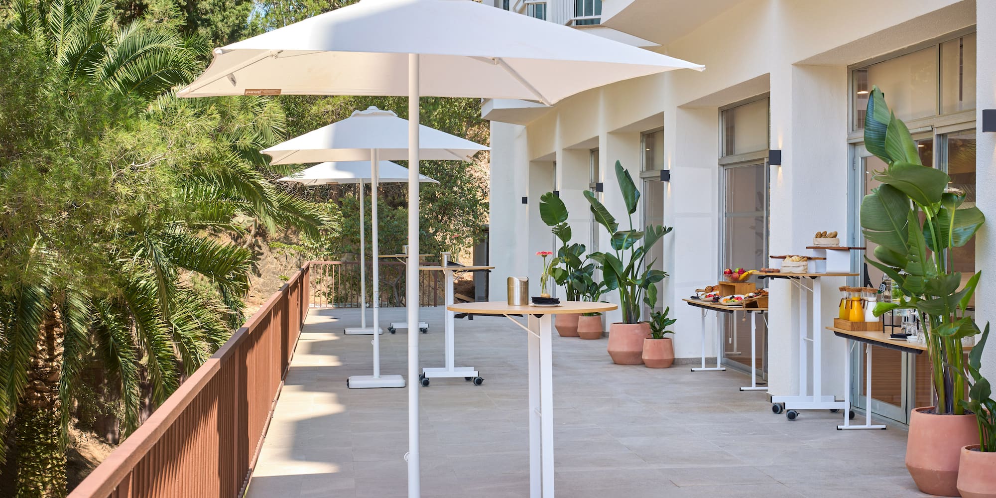 a patio with umbrellas and tables